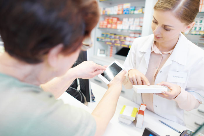 photo of a pharmacist helping customer