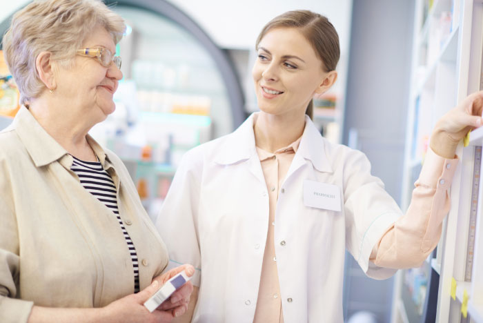 photo of a pharmacist helping patient